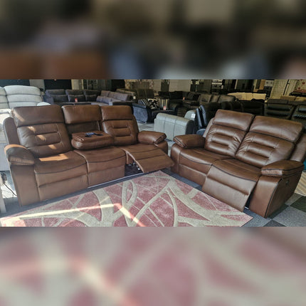 Brown leather reclining sofas in a showroom.