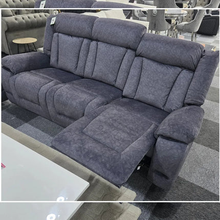 Gray reclining sofa in a showroom setting