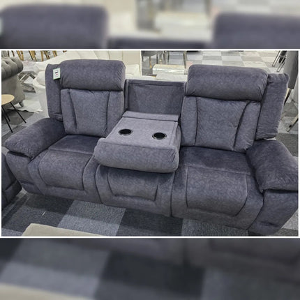 Gray recliner sofa with cup holders in a showroom setting