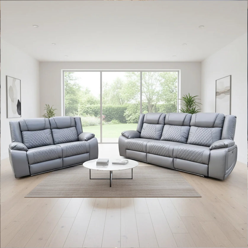 Gray leather sofa set in a modern living room with large windows. Envogue Furniture Limited