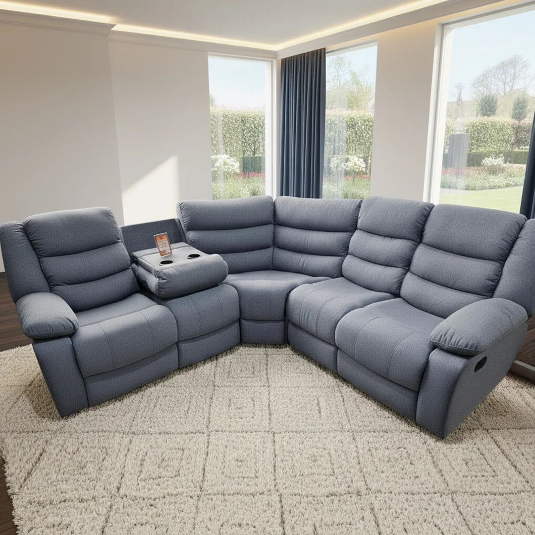 Gray sectional sofa in a living room with large windows.
