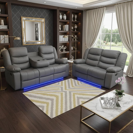 Modern living room with gray sofa set, bookshelves, and a coffee table. Envogue Furniture Limited